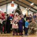 A community gathering of children and families in Greenland during a festive event, illustrating the youth and local life in Nuuk