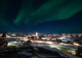 The city of Nuuk, Greenland at night. Reliable energy infrastructure is a critical lifeline for the Arctic capital during extreme weather