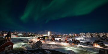 The city of Nuuk, Greenland at night. Reliable energy infrastructure is a critical lifeline for the Arctic capital during extreme weather