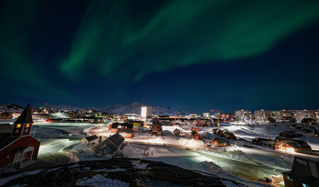 The city of Nuuk, Greenland at night. Reliable energy infrastructure is a critical lifeline for the Arctic capital during extreme weather