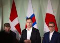 Greenlandic PM Jens-Frederik Nielsen speaking at a press conference with Danish and Faroese officials behind him