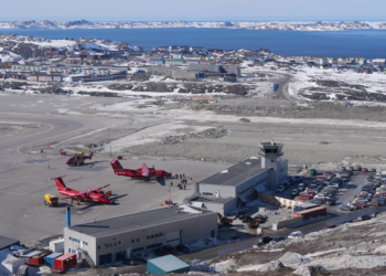 Aerial view of the new Nuuk International Airport terminal and runway in winter, Greenland